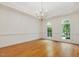 Bright dining room with hardwood floors, crown molding and two large arched windows providing natural light at 1428 Gray Bluff Trl, Chapel Hill, NC 27517