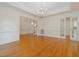 Spacious dining room with hardwood floors, chandelier, and molding details throughout the home at 1428 Gray Bluff Trl, Chapel Hill, NC 27517