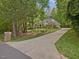 View of home showcasing a long driveway, and mature landscaping at 1428 Gray Bluff Trl, Chapel Hill, NC 27517