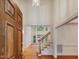 Bright foyer with hardwood floors, staircase, and high ceilings welcomes you home at 1428 Gray Bluff Trl, Chapel Hill, NC 27517