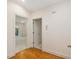 Hallway with hardwood floors and white trim, leading to bedrooms at 1428 Gray Bluff Trl, Chapel Hill, NC 27517