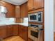 Modern kitchen with stainless steel appliances, including a built-in microwave and oven at 1428 Gray Bluff Trl, Chapel Hill, NC 27517