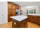 Beautiful kitchen with custom cabinetry, stainless steel refrigerator, and a functional island at 1428 Gray Bluff Trl, Chapel Hill, NC 27517