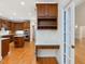 Charming kitchen area featuring a built-in desk and access to natural light at 1428 Gray Bluff Trl, Chapel Hill, NC 27517