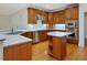 Well-equipped kitchen with custom cabinets, stainless steel appliances, and a functional center island at 1428 Gray Bluff Trl, Chapel Hill, NC 27517