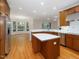 Spacious kitchen with hardwood floors, center island, and stainless steel appliances and abundant natural light at 1428 Gray Bluff Trl, Chapel Hill, NC 27517