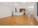 Open living area leading to a modern kitchen with stainless steel appliances at 1428 Gray Bluff Trl, Chapel Hill, NC 27517