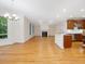 Open-concept living area with fireplace adjacent to the modern kitchen at 1428 Gray Bluff Trl, Chapel Hill, NC 27517