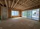 Interior space with exposed framing, large windows, and sliding glass doors at 1521 Sunrise Ave, Raleigh, NC 27608