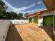 A patio is under construction with wood framing and green sheathing, surrounded by trees at 1521 Sunrise Ave, Raleigh, NC 27608