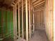 A staircase under construction shows wood framing that goes from the lower to upper level at 1521 Sunrise Ave, Raleigh, NC 27608