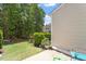 A quaint backyard area with a small patio and green landscaping at 1710 Grace Point Rd, Morrisville, NC 27560