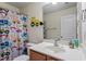 A bathroom with a truck-themed shower curtain and decor at 1710 Grace Point Rd, Morrisville, NC 27560