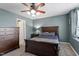 Bedroom with a dark wood furniture, a ceiling fan, and a window at 1710 Grace Point Rd, Morrisville, NC 27560