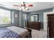 Bedroom featuring a ceiling fan, a window, and a chest of drawers at 1710 Grace Point Rd, Morrisville, NC 27560