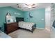 A cute bedroom with a bed and dinosaur themed decor at 1710 Grace Point Rd, Morrisville, NC 27560