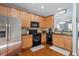 Well-equipped kitchen with stainless steel appliances, ample cabinetry, and hardwood floors at 1710 Grace Point Rd, Morrisville, NC 27560