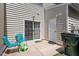 This patio has a sliding door, chairs, and outdoor storage at 1710 Grace Point Rd, Morrisville, NC 27560