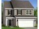 Charming two-story home with a two-car garage and beautifully landscaped front yard at 174 Muskogee Rd # 54, Angier, NC 27501