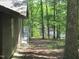Wonderful view of the lake beyond the house with mature trees and a well-maintained yard at 1812 Crepe Myrtle Dr, Sanford, NC 27330
