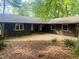Charming single-story home with a brown exterior and meticulously maintained landscaping in a lovely wooded setting at 1812 Crepe Myrtle Dr, Sanford, NC 27330