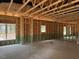 Living room framing showing wiring, and several window locations at 214 Green Pines Estates Dr, Kenly, NC 27542