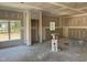 Spacious living room showing drywall, natural light from windows, and an open floor plan during construction at 214 Green Pines Estates Dr, Kenly, NC 27542