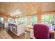 Bright bonus room with wood paneled walls and natural light at 220 Cardinal Dr, Youngsville, NC 27596
