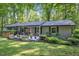 Charming single-story home with a inviting front porch and a beautifully landscaped yard and pretty planters at 220 Cardinal Dr, Youngsville, NC 27596