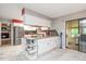Open-concept kitchen with island, stainless appliances, and access to bonus room at 220 Cardinal Dr, Youngsville, NC 27596