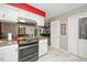 Functional kitchen with view of dining room, dark appliances, and stylish cabinets at 220 Cardinal Dr, Youngsville, NC 27596
