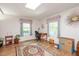 Bright living room with hardwood floors, a skylight, a stylish desk and windows with great natural light at 220 Cardinal Dr, Youngsville, NC 27596