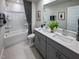 This bathroom features a vanity with double sinks, a shower/tub, and modern finishes at 2230 Cherry Creek Rd, Haw River, NC 27258