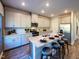 Kitchen island with granite countertops, stainless steel appliances, and seating for four at 2230 Cherry Creek Rd, Haw River, NC 27258