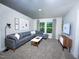 Cozy living room offers a sectional couch, stylish décor, and a flatscreen TV at 2230 Cherry Creek Rd, Haw River, NC 27258