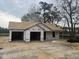 Image displays new construction of a single-story home with an attached two-car garage, awaiting finishing touches at 2555 Whitetail Rd, Nashville, NC 27856