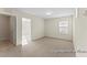 Open bedroom with carpeted floor, neutral walls, and an entryway leading to another room at 260 Curling Creek Dr # 235P, Clayton, NC 27527