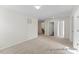 Spacious bedroom with neutral carpet, ample natural light, and convenient access to the bathroom at 260 Curling Creek Dr # 235P, Clayton, NC 27527