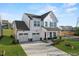 Charming two-story home with a two car garage and covered front porch offering a welcoming curb appeal at 260 Curling Creek Dr # 235P, Clayton, NC 27527