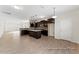 Modern, bright kitchen with a center island, stainless steel appliances, and an open floor plan at 260 Curling Creek Dr # 235P, Clayton, NC 27527