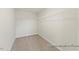 Spacious walk-in closet with carpeted flooring and wire shelving, ready for organization and storage at 260 Curling Creek Dr # 235P, Clayton, NC 27527