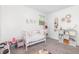 Bedroom featuring a crib, neutral walls, carpeted flooring and decor at 2746 Saint Lukes Church Rd, Goldston, NC 27252
