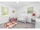 Bedroom featuring a crib, neutral walls, carpeted flooring and decor at 2746 Saint Lukes Church Rd, Goldston, NC 27252
