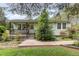 Quaint single story home with a covered front porch, sidewalk, light gray siding, and mature landscaping at 2746 Saint Lukes Church Rd, Goldston, NC 27252