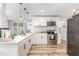 Bright kitchen with stainless steel appliances, subway tile backsplash and white cabinetry at 2746 Saint Lukes Church Rd, Goldston, NC 27252