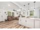 Spacious living room features new flooring, modern lighting and an open concept to the kitchen at 2746 Saint Lukes Church Rd, Goldston, NC 27252