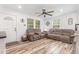 Inviting living room features new flooring, a ceiling fan and lots of natural light at 2746 Saint Lukes Church Rd, Goldston, NC 27252
