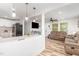 Open concept layout with updated kitchen, modern lighting and cozy living room with new floors at 2746 Saint Lukes Church Rd, Goldston, NC 27252