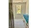Bright bathroom includes white marble floors, vanity, tub and a window with a view, offering a serene and functional space at 2802 Packing Plant Rd, Smithfield, NC 27577