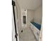 Bright hallway features white marble floors and fresh white cabinets, awaiting final touches and personalization at 2802 Packing Plant Rd, Smithfield, NC 27577